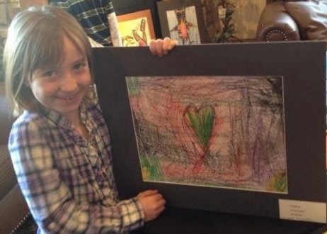 Young Greta Saylor with Untitled Heart at the Two Rivers Winery Art Show